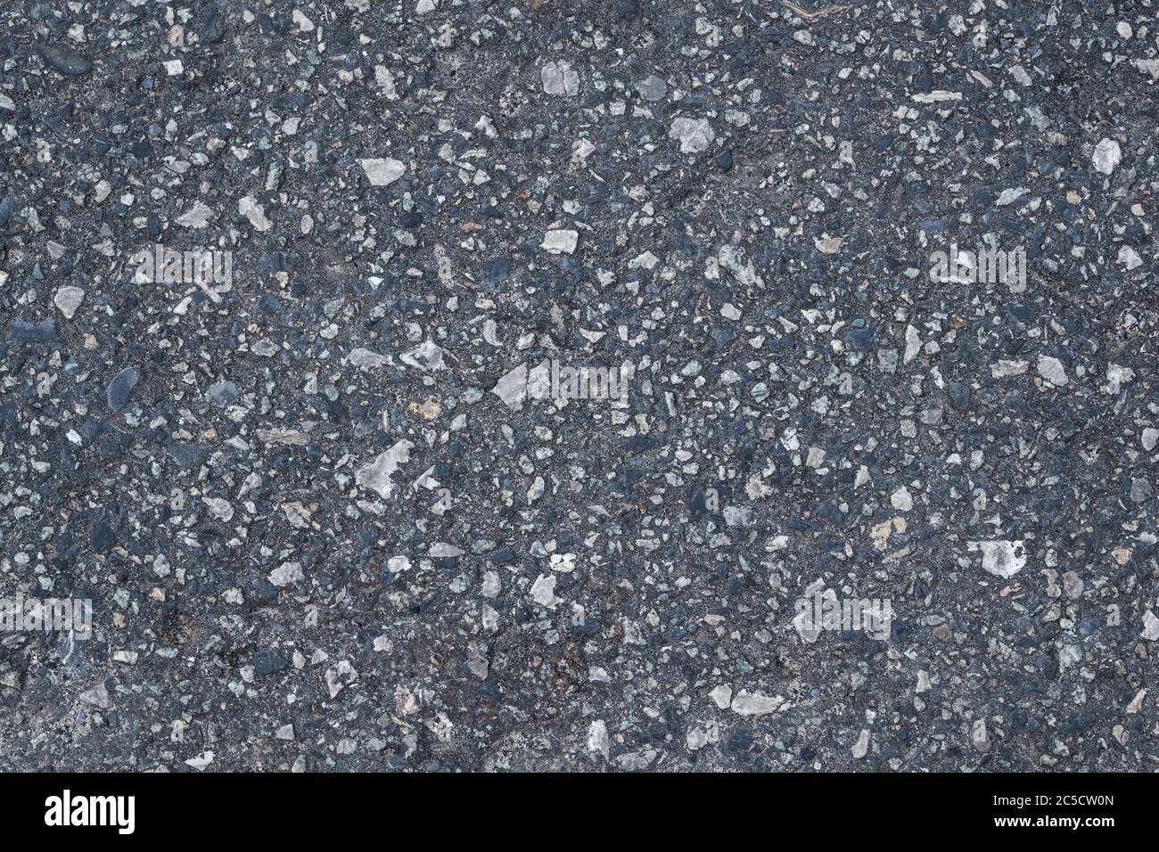 Vecchia strada fatta di piccole pietre. Texture e sfondo per il tuo design Foto Stock