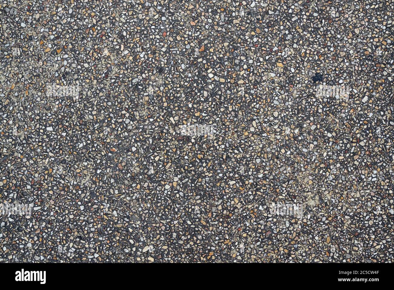 Strada fatta da piccole pietre. Texture e sfondo per il tuo design Foto Stock