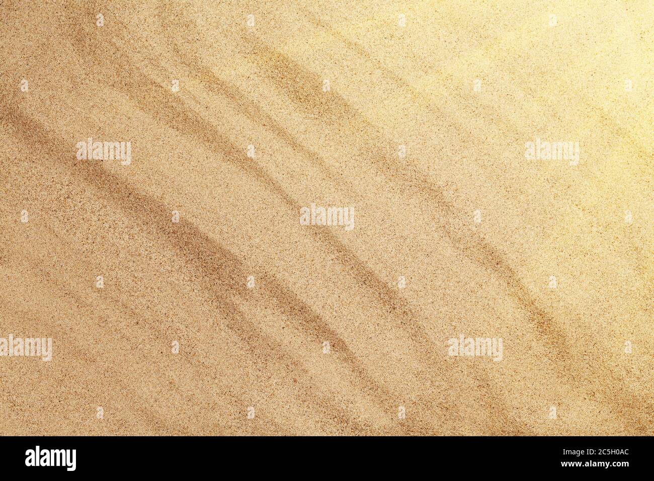 Sfondo di sabbia calda. Spiaggia soleggiata sfondo. Vista dall'alto con spazio per la copia Foto Stock