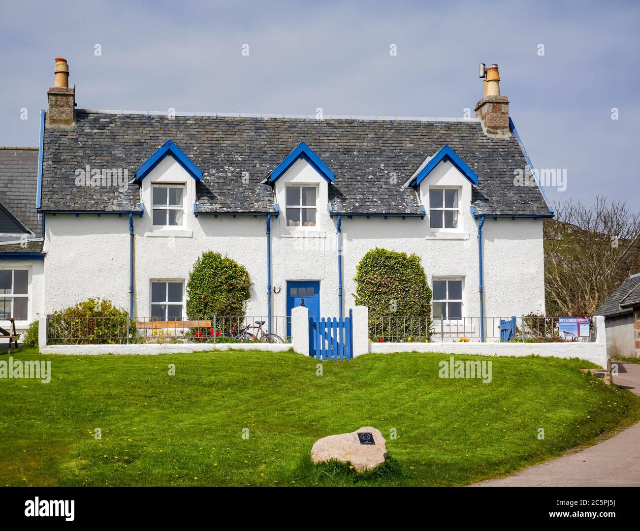 Casa tradizionale con finestre dormitori sull'Isola di Iona, Mull, Ebridi interne, Scozia, Regno Unito Foto Stock