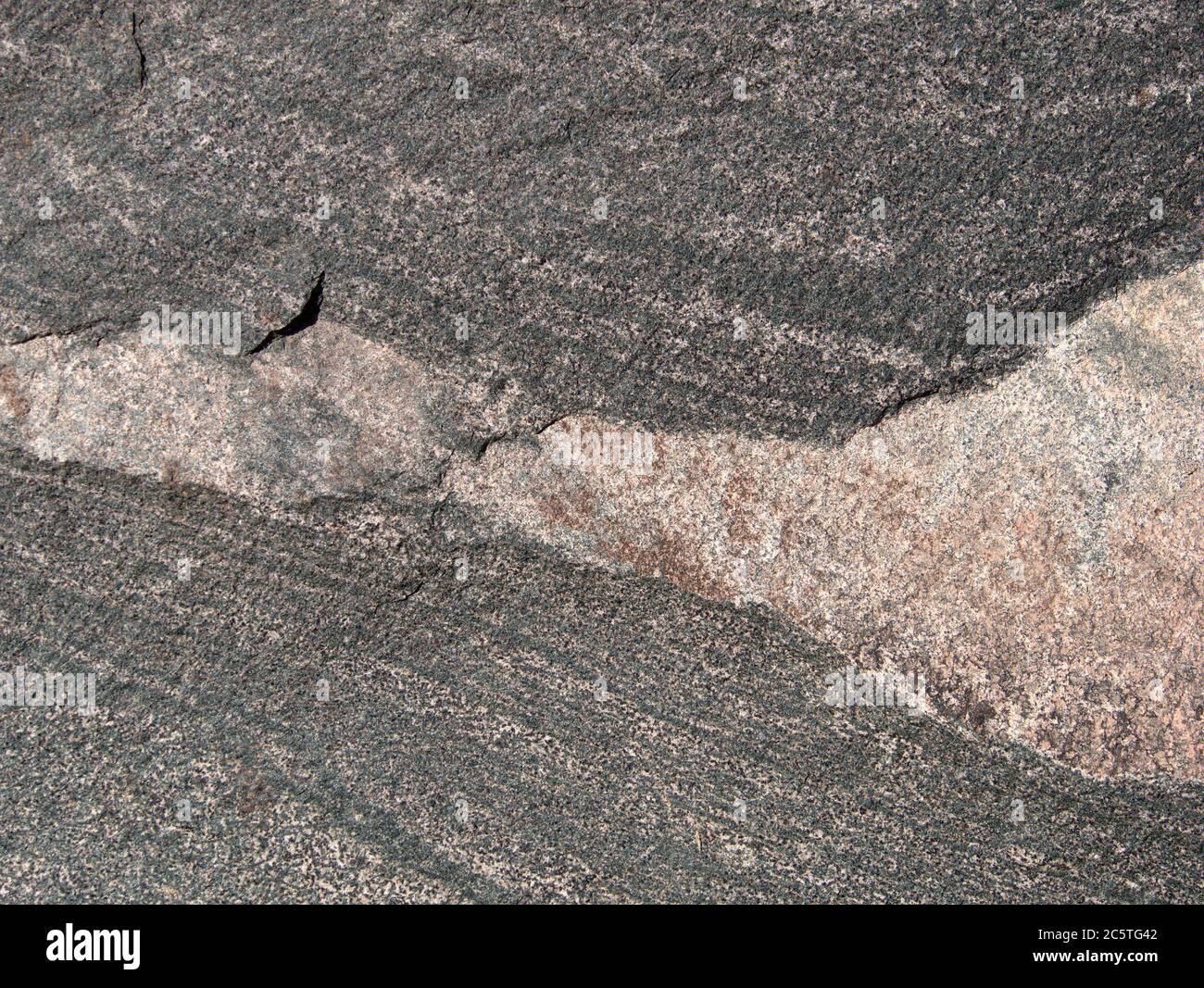 Varie lastre di pietra di granito, basalto o arenaria, da grigio a colorato, come sfondo, primo piano Foto Stock