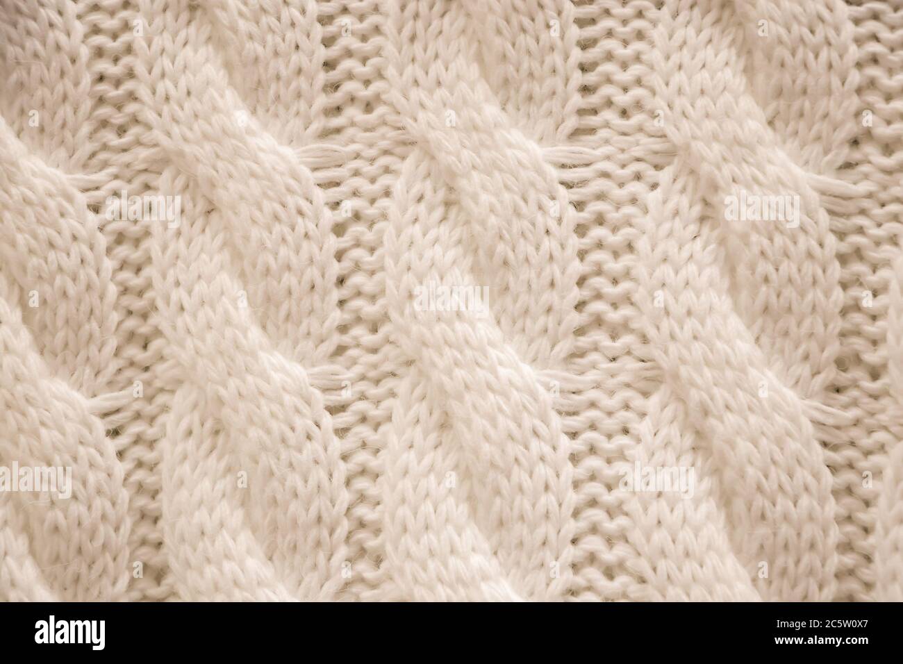 La texture di un pullover a maglia intima. Maglieria, accessori per la casa. Foto Stock
