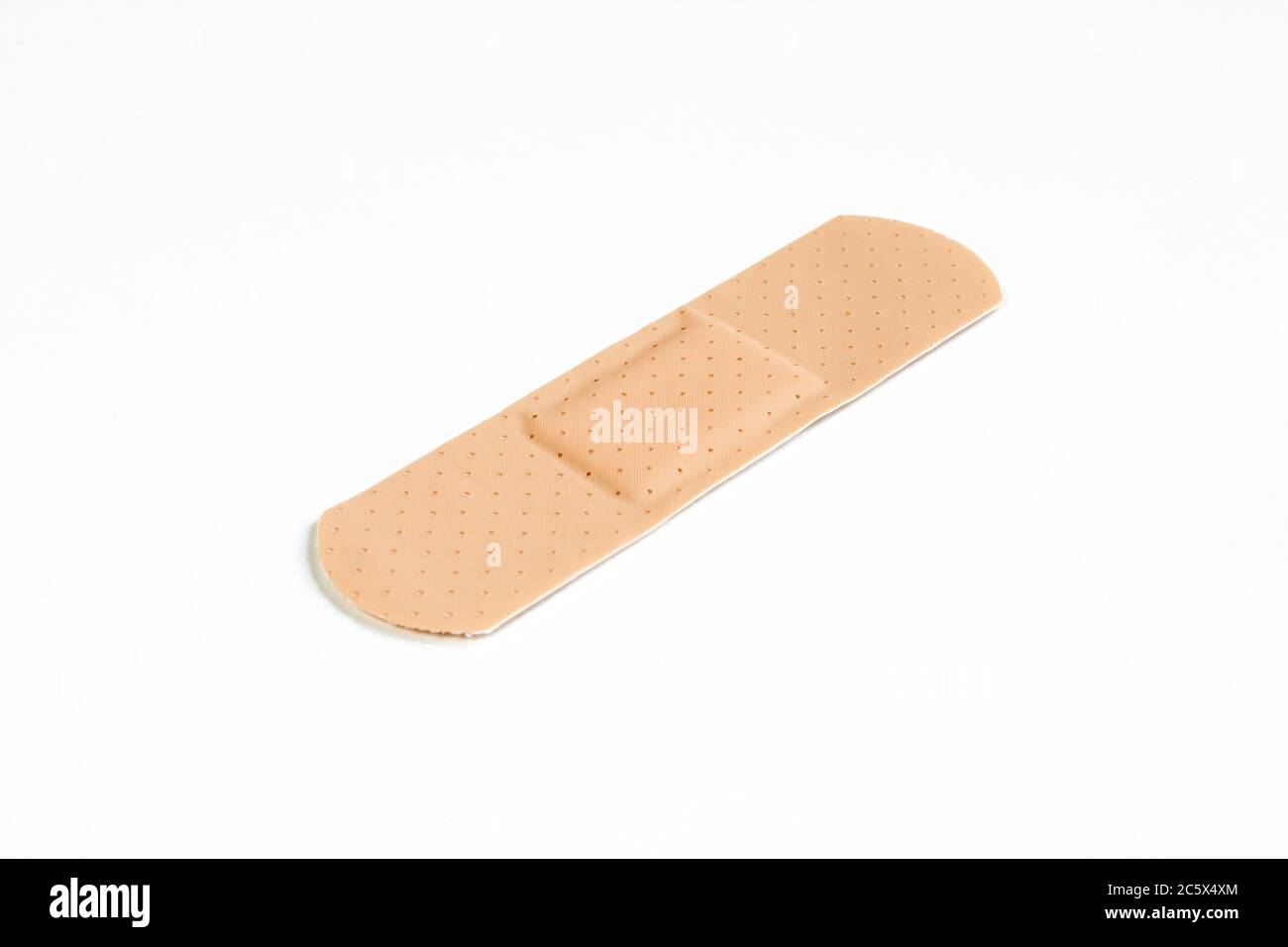 Intonaco isolato su fondo bianco. Protezione da bendaggio arancione Foto Stock