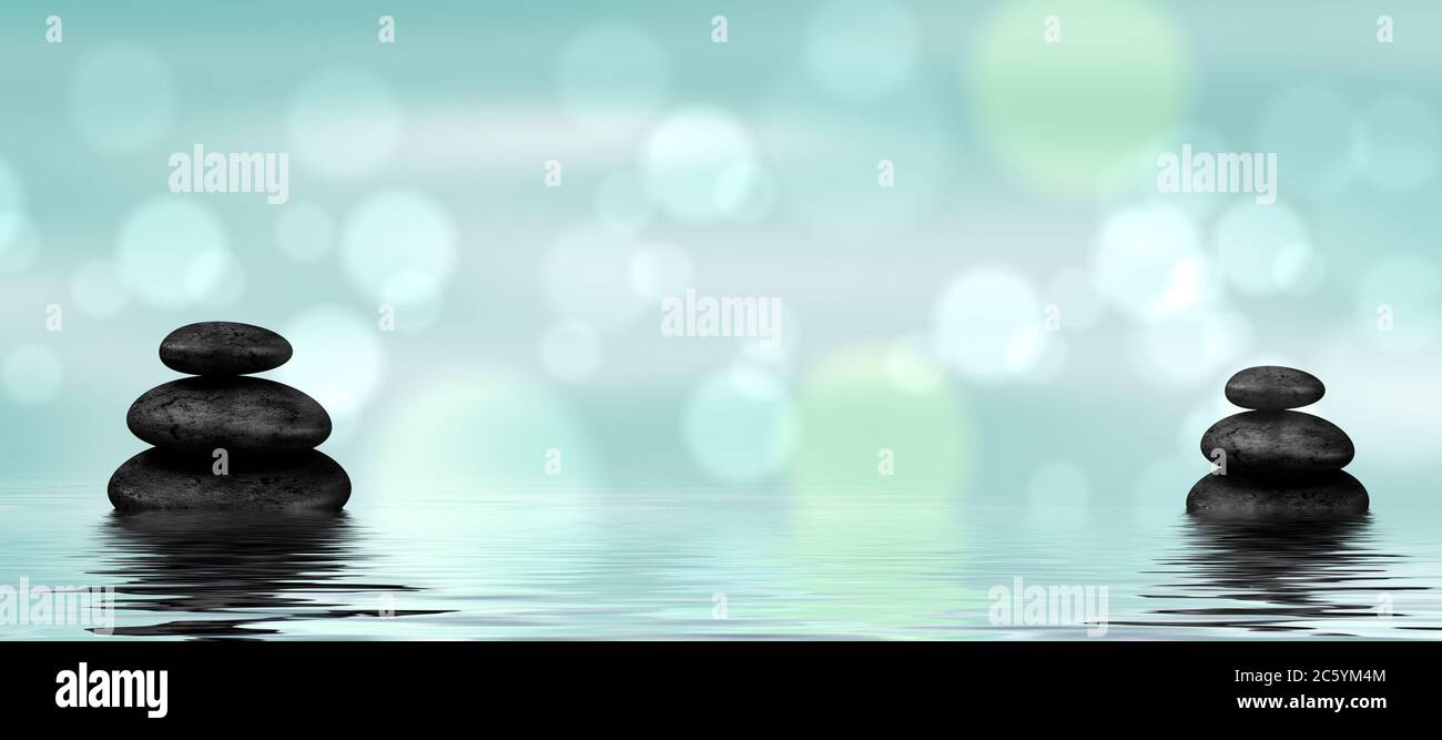 Spa - terapia alternativa naturale con pietre di massaggio in acqua Foto Stock