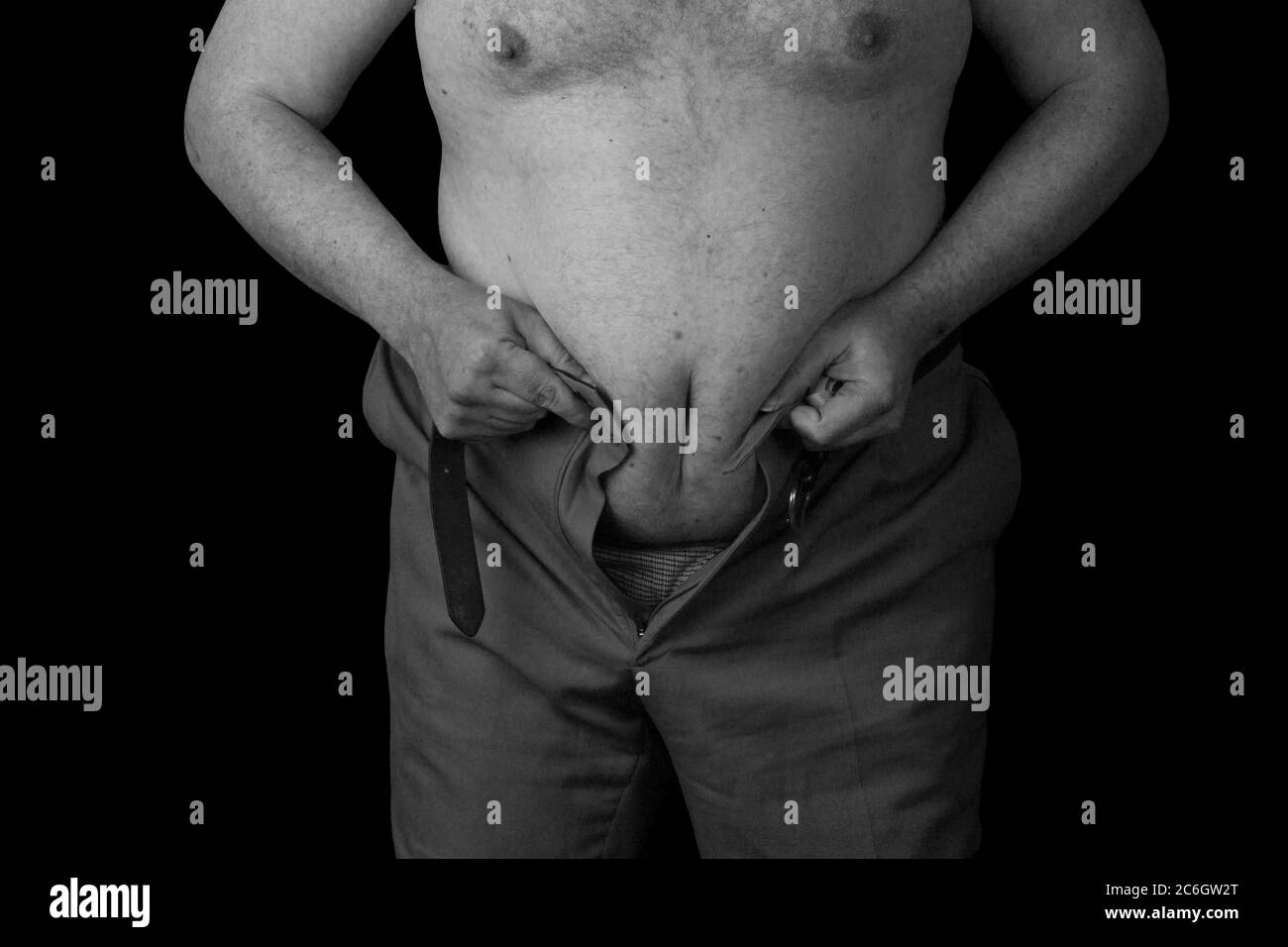 La persona in sovrappeso non può essere ferocato. Foto in bianco e nero Foto Stock