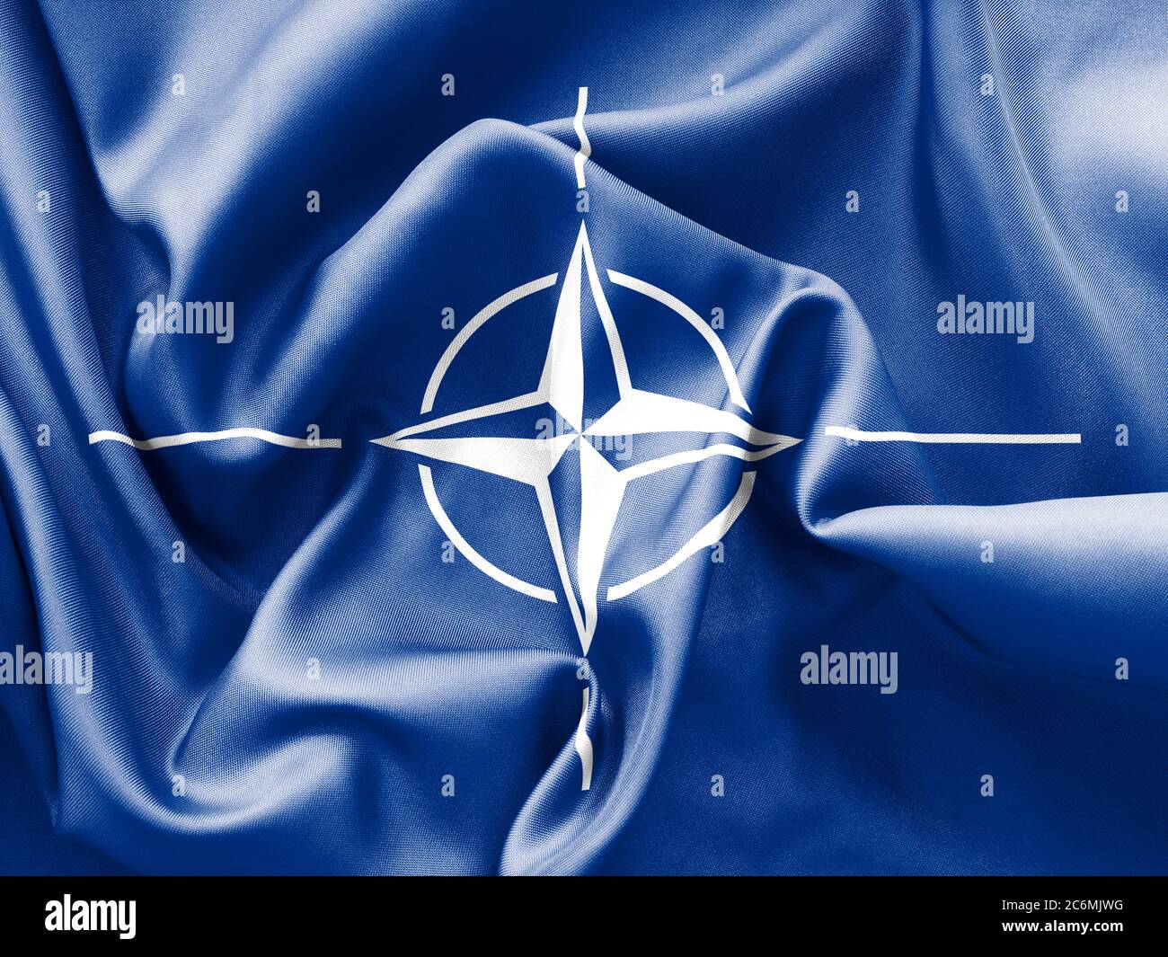 La trama della bandiera NATO è crespata e sbriciolata con luce e ombre Foto Stock