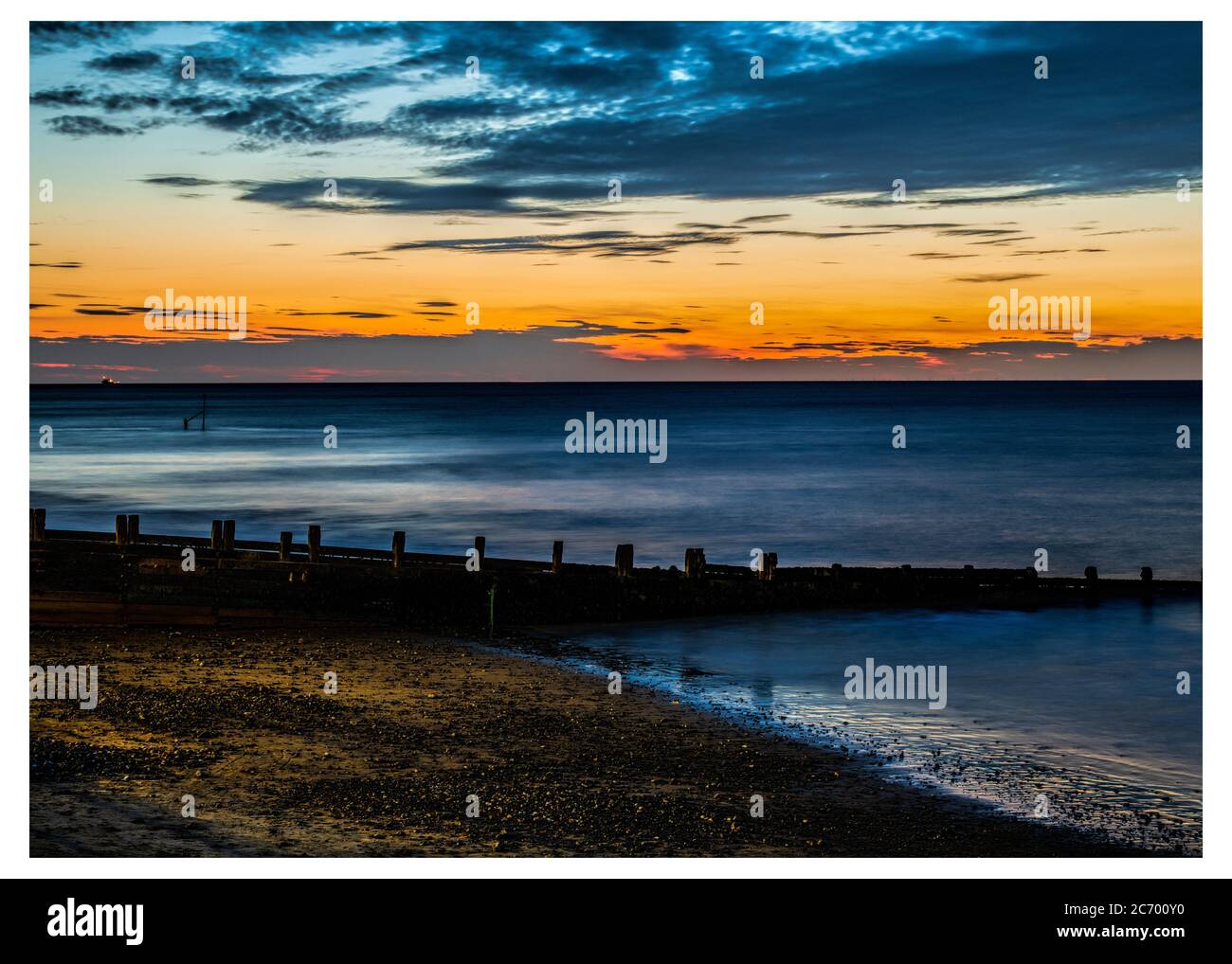 Cromer spiaggia in estate tramonto sera Foto Stock