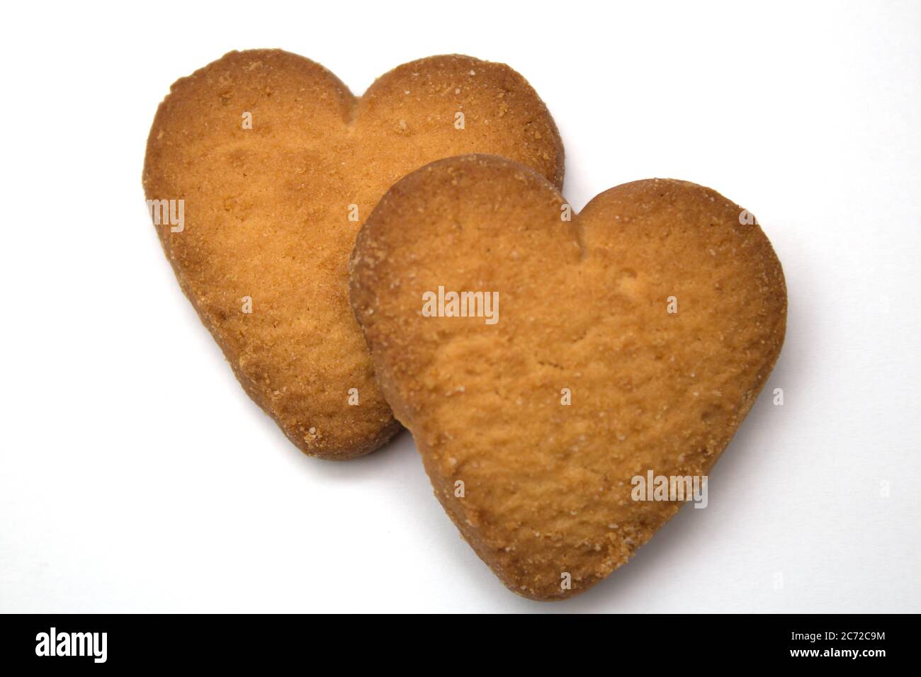 Due gustosi biscotti sotto forma di cuori, due cuori insieme - un simbolo di amore Foto Stock