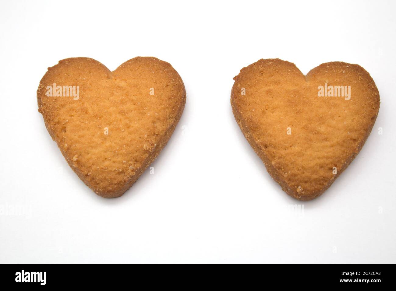 Due gustosi biscotti sotto forma di cuori, due cuori insieme - un simbolo di amore Foto Stock