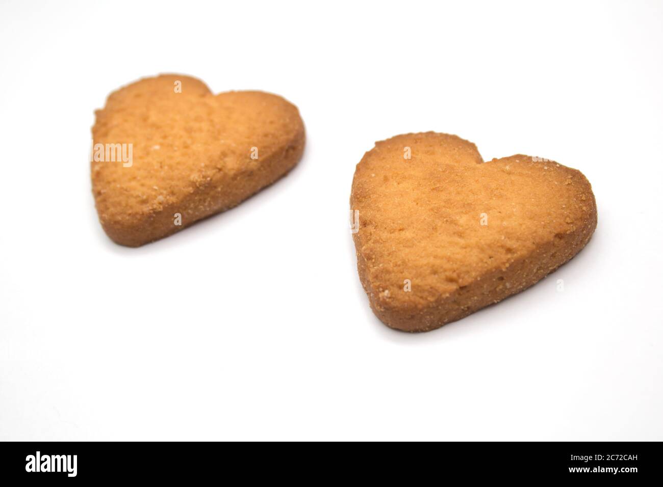 Due gustosi biscotti sotto forma di cuori, due cuori insieme - un simbolo di amore Foto Stock