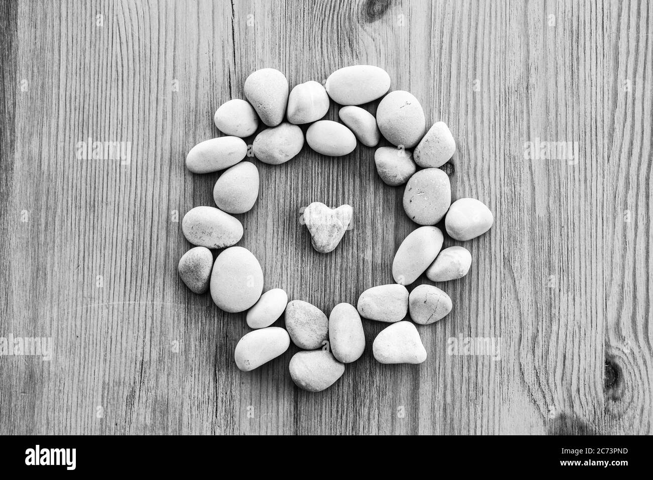 Cuore rustico bianco Pebble Foto Stock