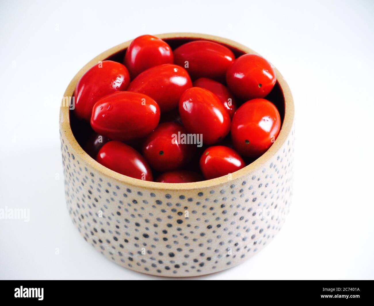 Pomodori pomodorini in una ciotola Foto Stock