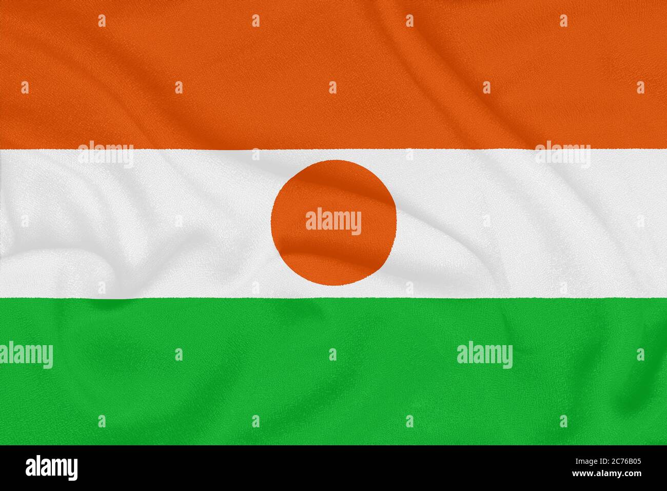 Bandiera del Niger su tessuto testurizzato. Simbolo patriottico Foto Stock