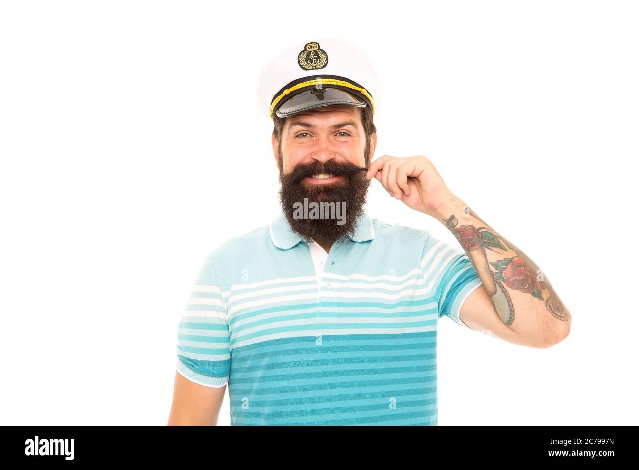 Nato per giocare con tempeste e venti. Capitano di mare isolato su bianco. Buon capitano baffi twirl. Comandante della nave. Uomo bearded in uniforme capitano. Crociera mondiale. Avventura marina. Viaggi in mare. Foto Stock