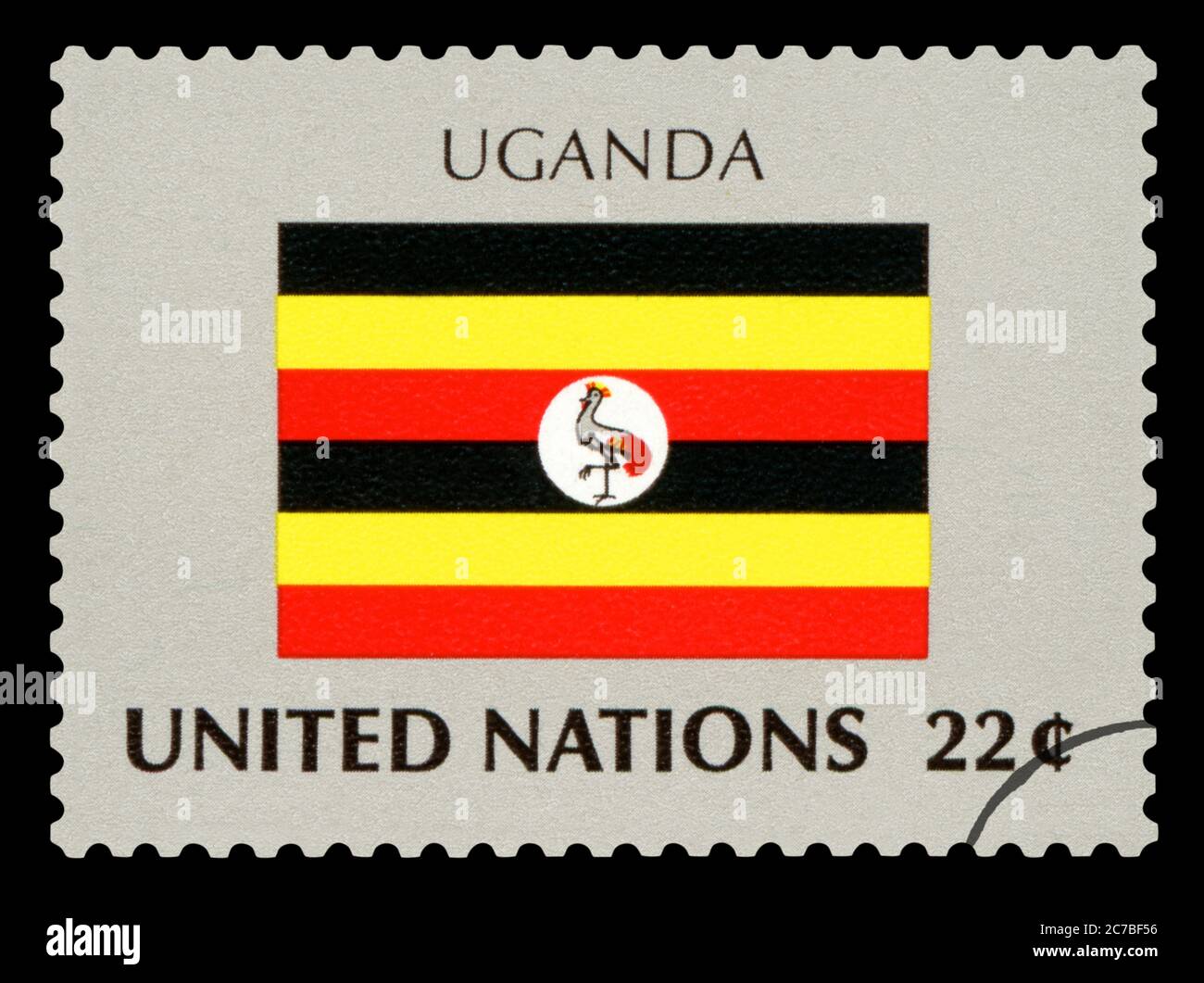 UGANDA - francobollo della bandiera nazionale ugandese, Serie delle Nazioni Unite, circa 1984. Isolato su sfondo nero. Foto Stock