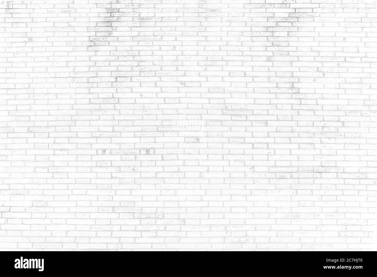 Pareti di mattoni bianchi che non sono intonacati sfondo e struttura. La struttura del mattone è bianca. Sfondo di muro di mattoni vuoto. Foto Stock