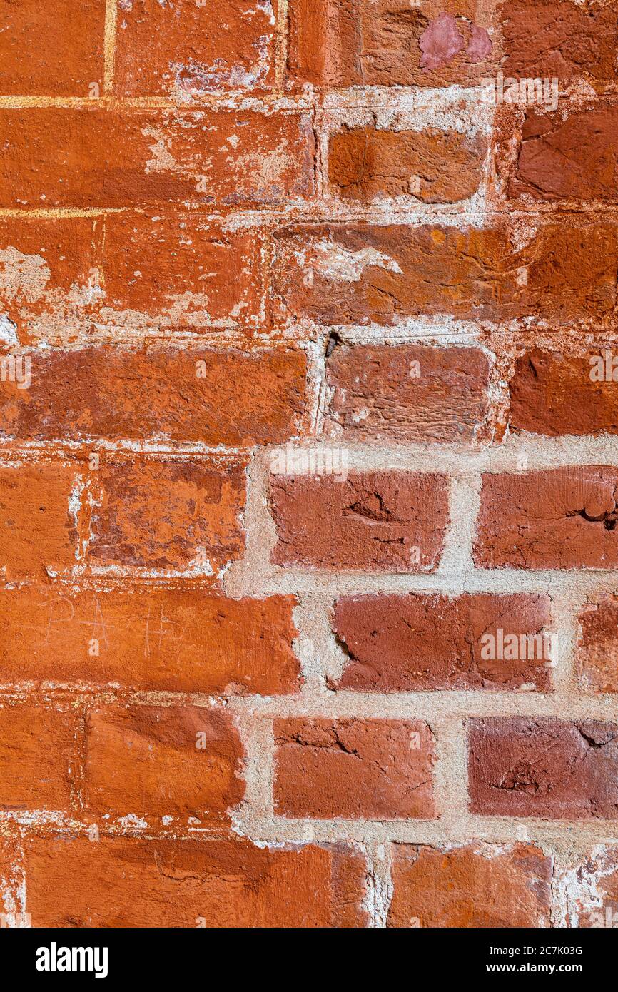 Vecchio muro con mattoni, facciata casa, sfondo Foto Stock