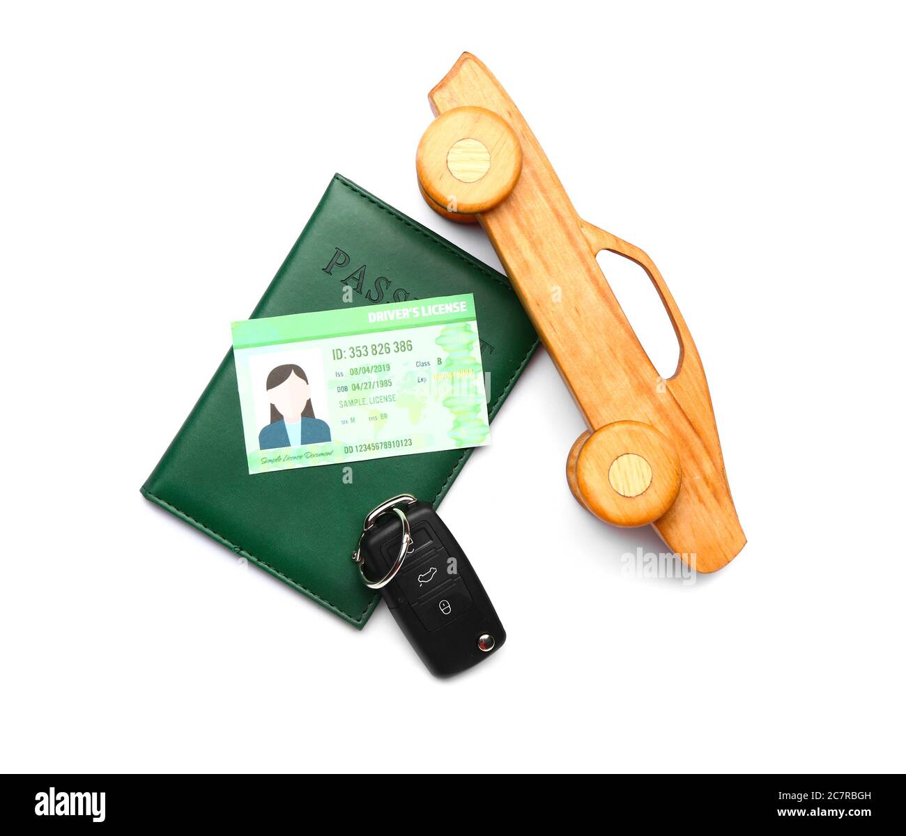 Patente di guida con passaporto e chiave dell'auto su sfondo bianco Foto Stock
