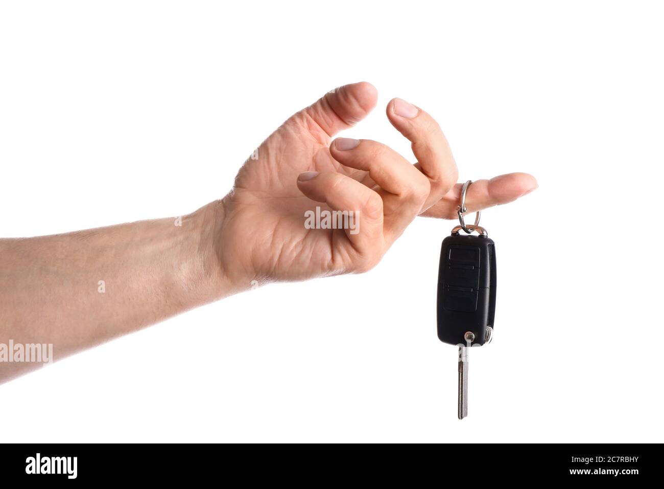 Mano maschile con chiave auto su sfondo bianco Foto Stock