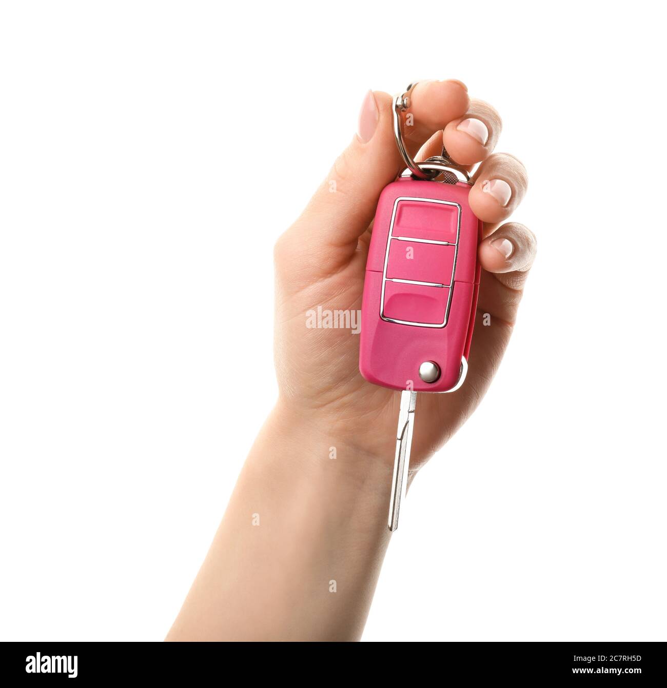 Mano femminile con chiave auto su sfondo bianco Foto Stock