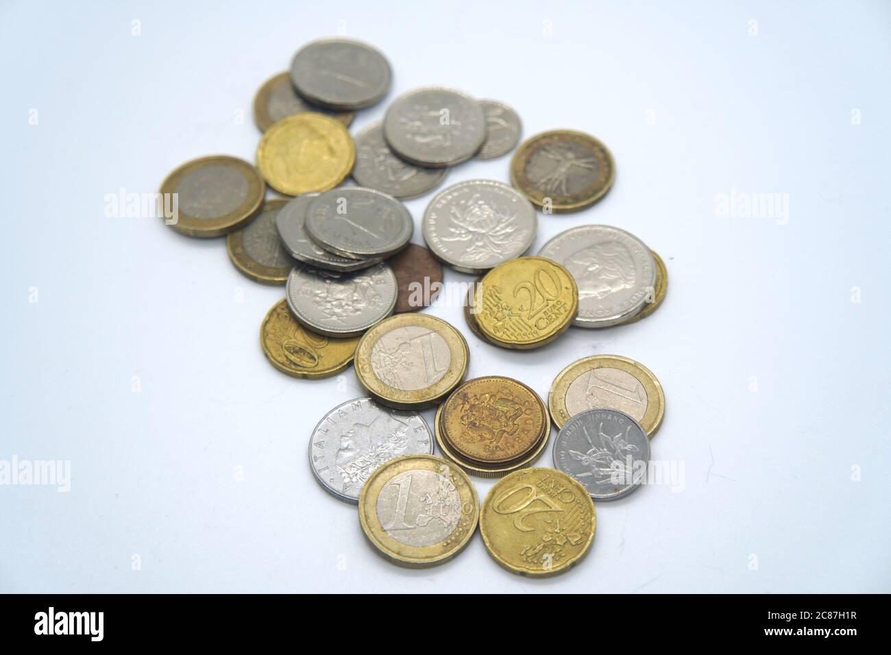 Monete internazionali assortite in argento e oro Foto Stock