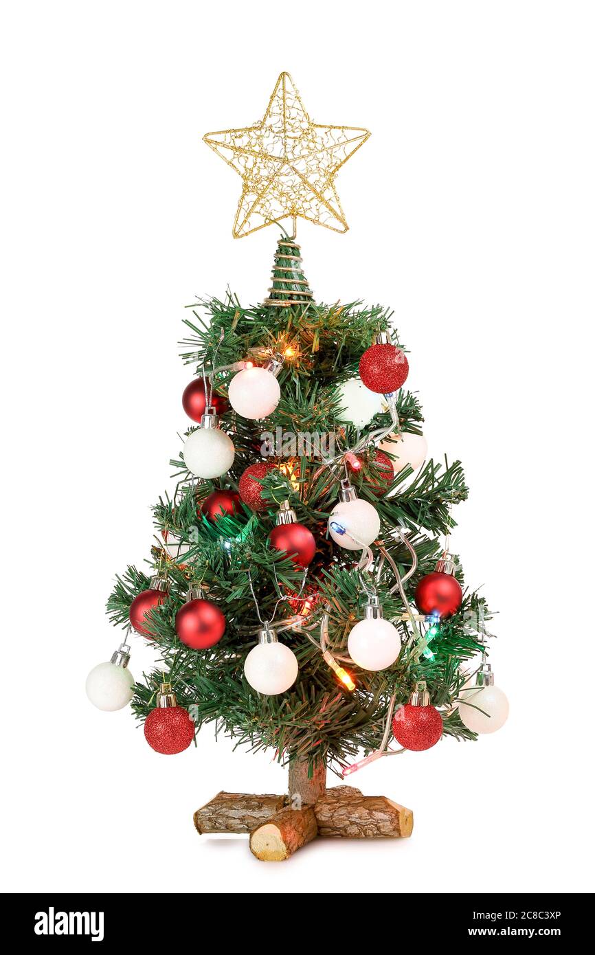 piccolo albero di natale con ornamenti e luci isolate su bianco Foto Stock