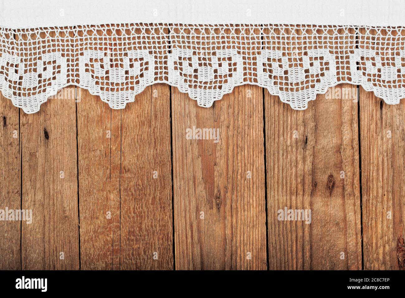 ricamo fatto a mano su superficie di legno intemperie Foto Stock