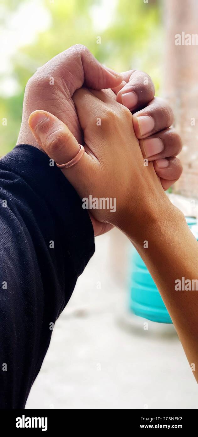 Le mani comuni mostrano la loro unità per tutta la vita Foto Stock
