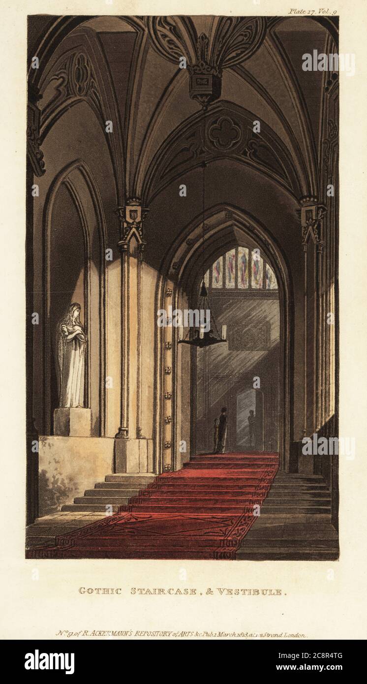 Scala gotica e vestibolo. Vista di un'alta sala d'ingresso ad arco con scale tappezzate, alcova con statua, lampadario a candela e vetrate colorate. Il risveglio gotico in architettura inglese durò dalla metà del XVIII secolo fino all'epoca vittoriana. Incisione a mano su copperplate dal Repository delle Arti, della Letteratura, dei Fashion, dei Manufactures, ecc. di Rudolph Ackermann, Strand, Londra, 1813. Foto Stock
