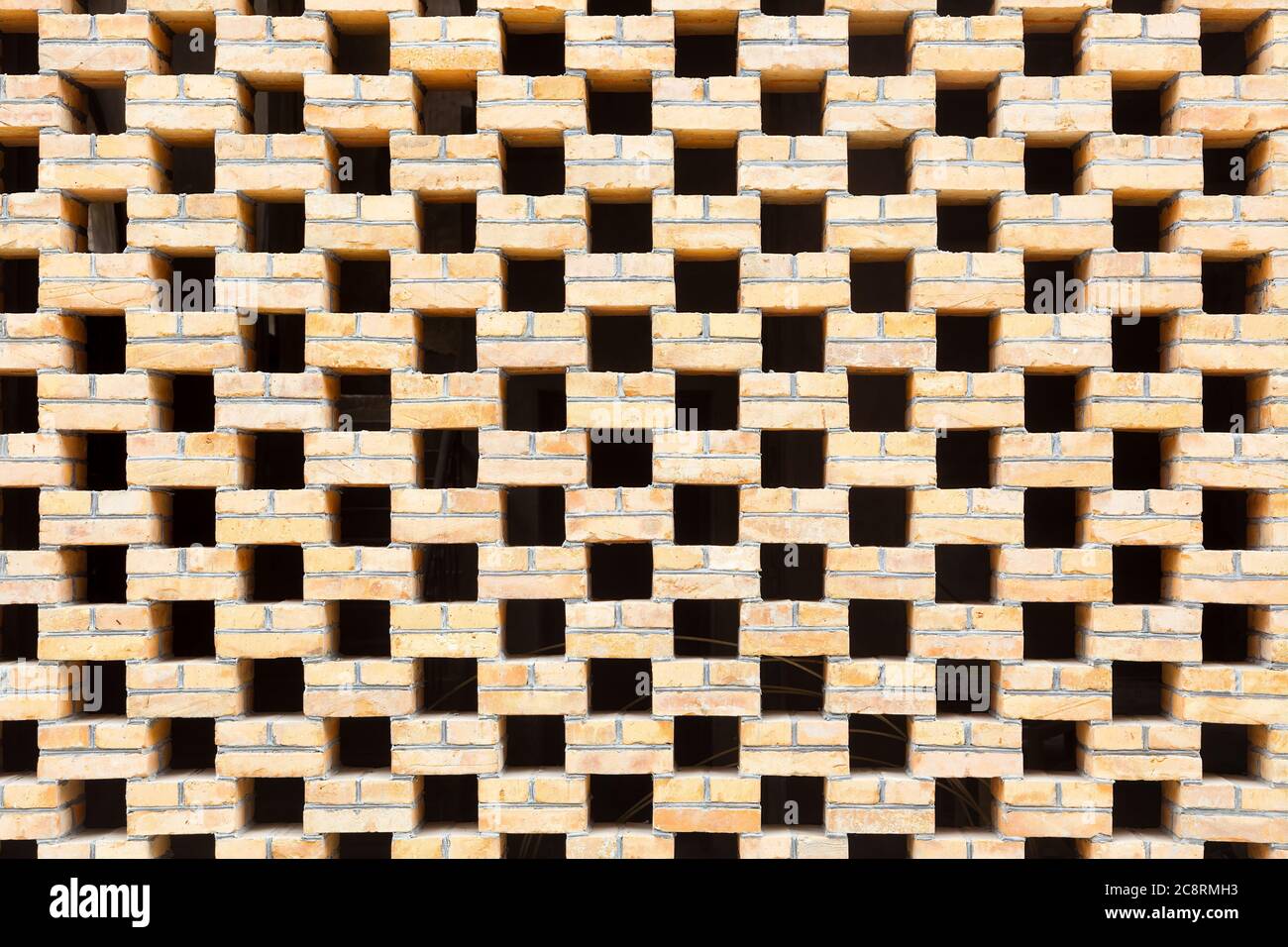 Buco nero e muro di mattoni di fondo texture, parte di tradizionale cinese mattoni di finestra reticolo nel sud-est della Cina Foto Stock