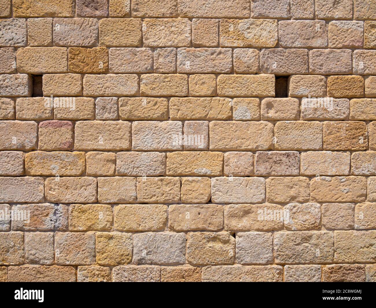 Reale antico brickwall arabo insoleggiato giorno di sfondo texture Foto Stock