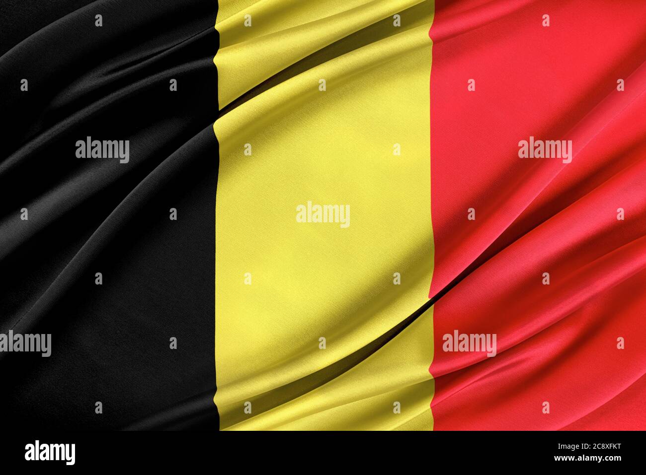 Bandiera belga colorata che sventola nel vento. Foto Stock