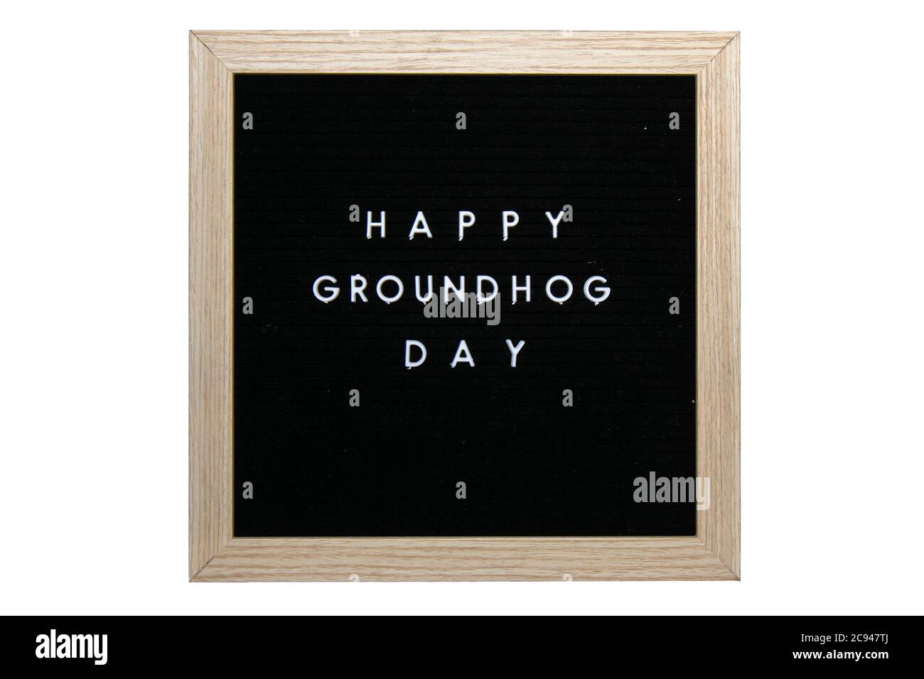 Un segno nero con una cornice di uccello che dice giorno felice di Groundhog in lettere bianche su uno sfondo bianco puro Foto Stock