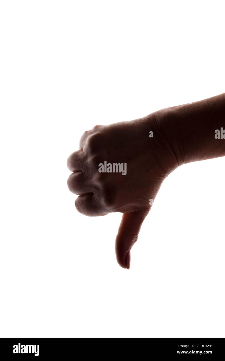 La mano femminile che punta dislike - silhouette, concetto male Foto Stock
