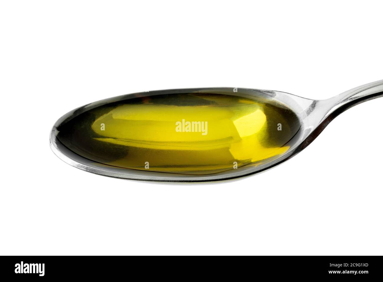 Cucchiaio di metallo con olio d'oliva da vicino Foto Stock