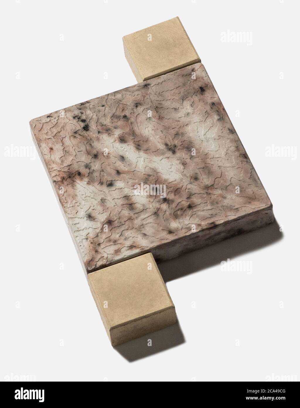 Un esempio di terra, parete di pietra sulla base unicolor Foto Stock