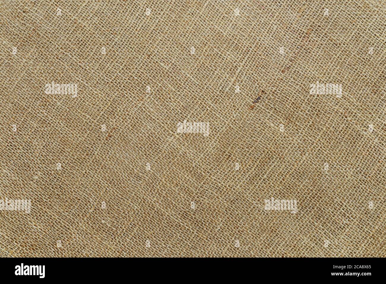Tessuto diagonale di colore naturale. Sackcloth rustico tela di fondo. Tessuti grezzi di lino, iuta o canapa. Elemento di progettazione. Vista dall'alto. Foto Stock