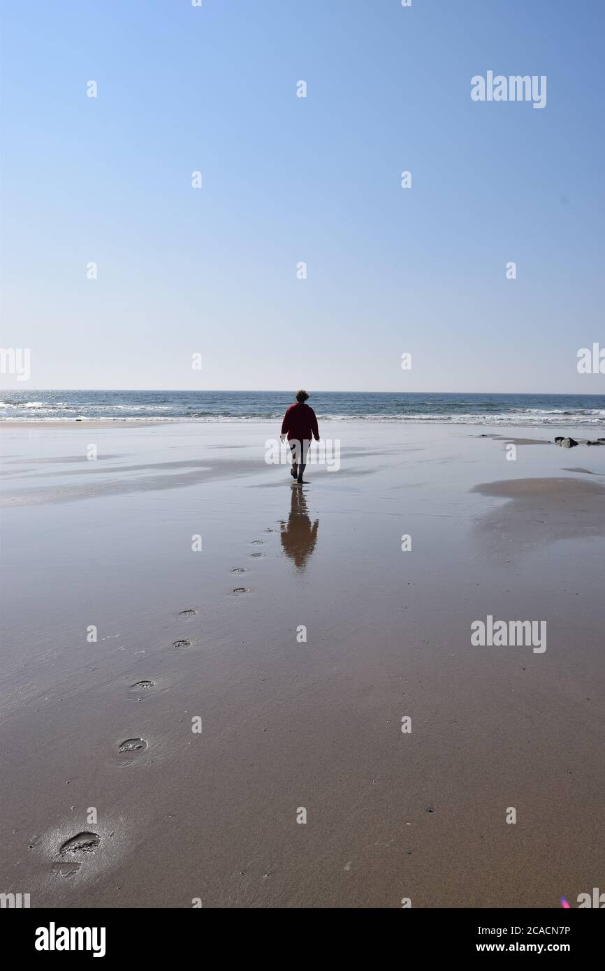 figura sulla spiaggia Foto Stock