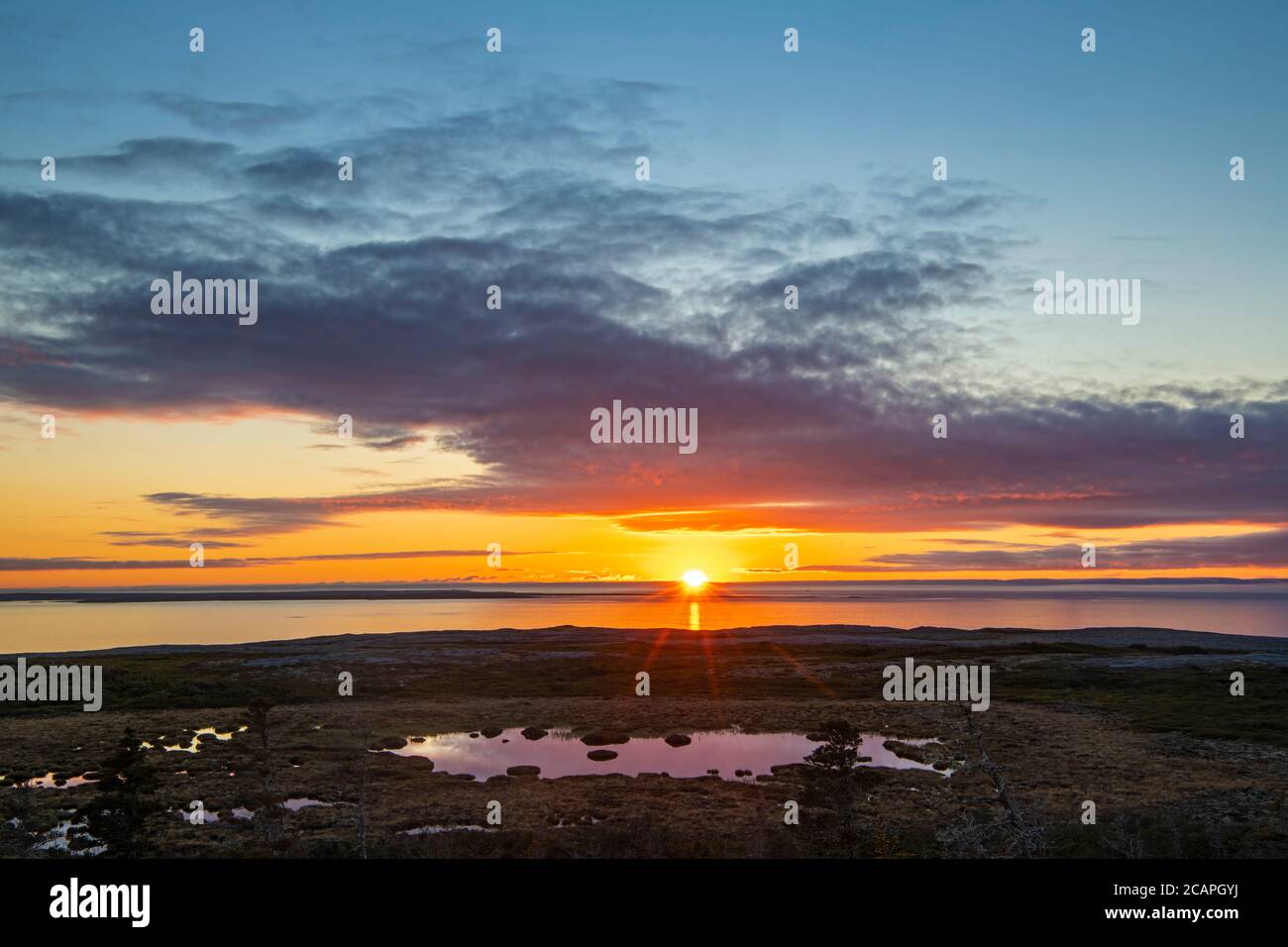 Tramonto su Pistolet Bay, Burned Cape Ecological Preserve, Raleigh, Terranova e Labrador NL, Canada Foto Stock