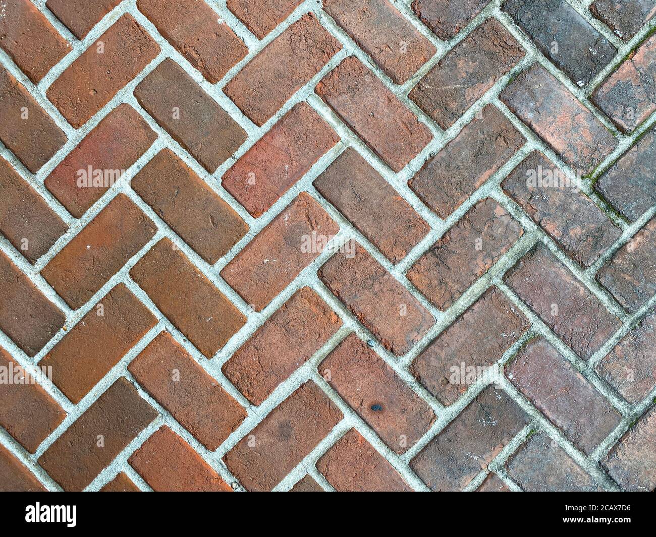 rosso pulito sbiadito sporco retrò cobblestone modello mattone pavé, colori ricchi e ombre adatto per sito web background marketing sfondi sfondi sfondi sfondi Foto Stock