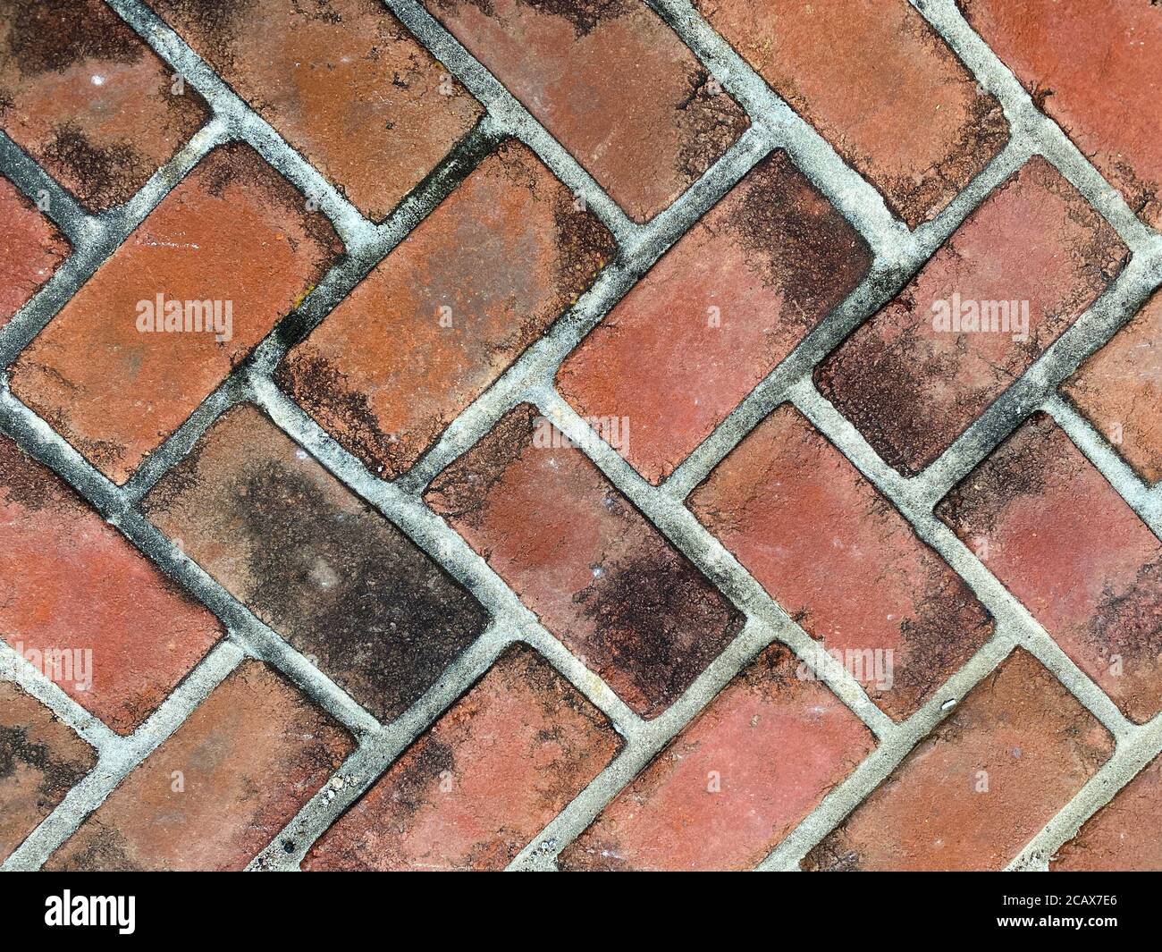 rosso vecchio sbiadito sporco primo piano ciottolato modello mattone pavé, colori ricchi e ombre adatti per sito web background marketing sfondi sfondi sfondi sfondi Foto Stock