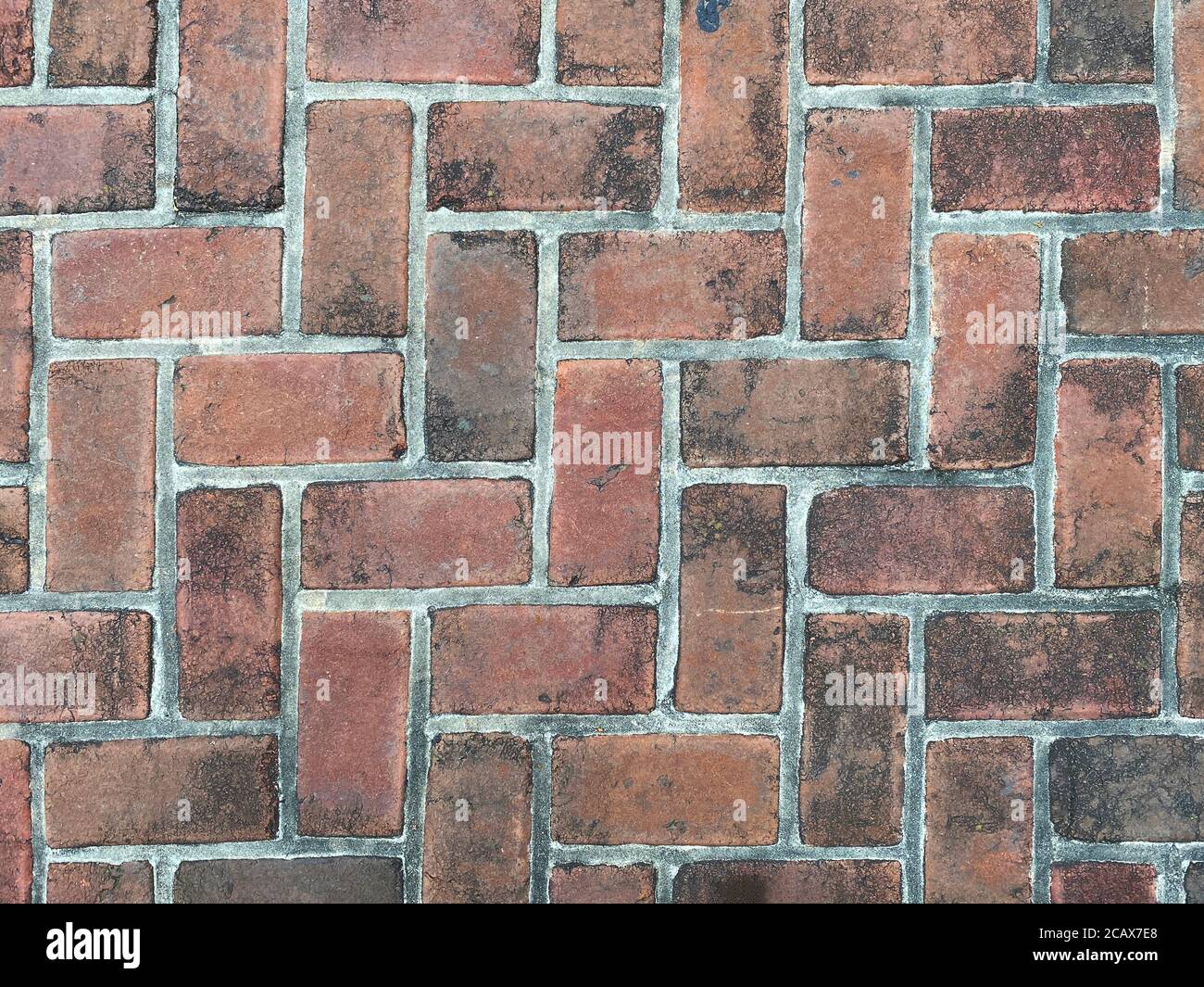 rosso sporco retrò vecchio vintage cobblestone modello mattone pavé, colori ricchi e ombre adatti per sito web background marketing sfondi sfondi sfondi sfondi Foto Stock