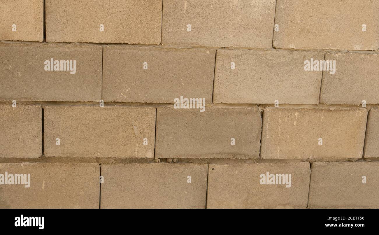 Struttura di fondo del blocco di parete in cemento, di recente costruzione Foto Stock