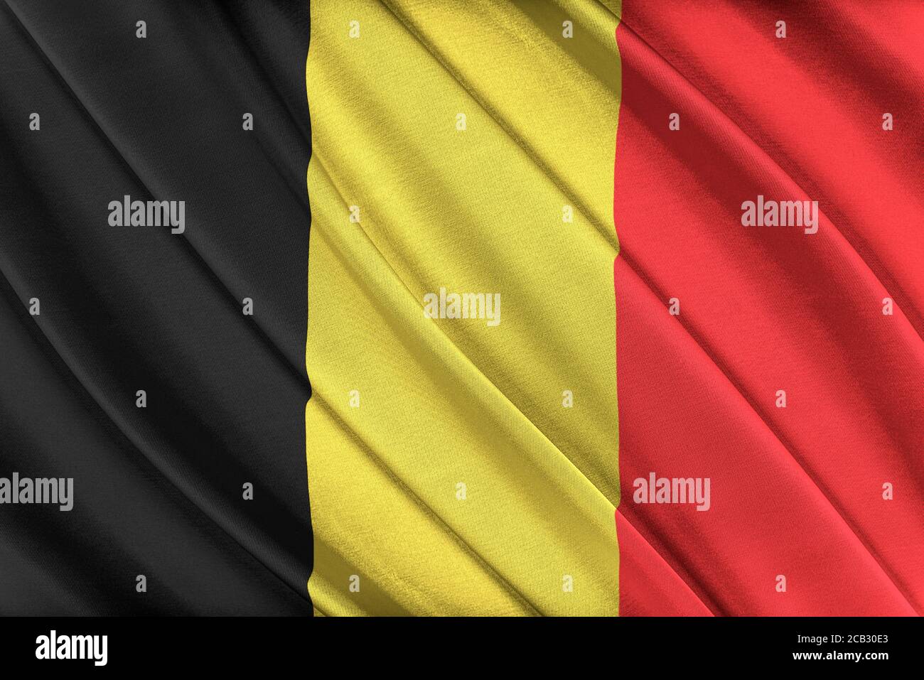 Bandiera belga colorata che sventola nel vento. Foto Stock