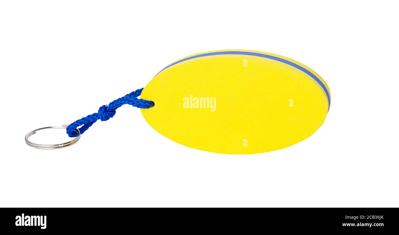 Portachiavi galleggianti personalizzati isolati su materiale in schiuma bianco, colore giallo, souvenir Foto Stock