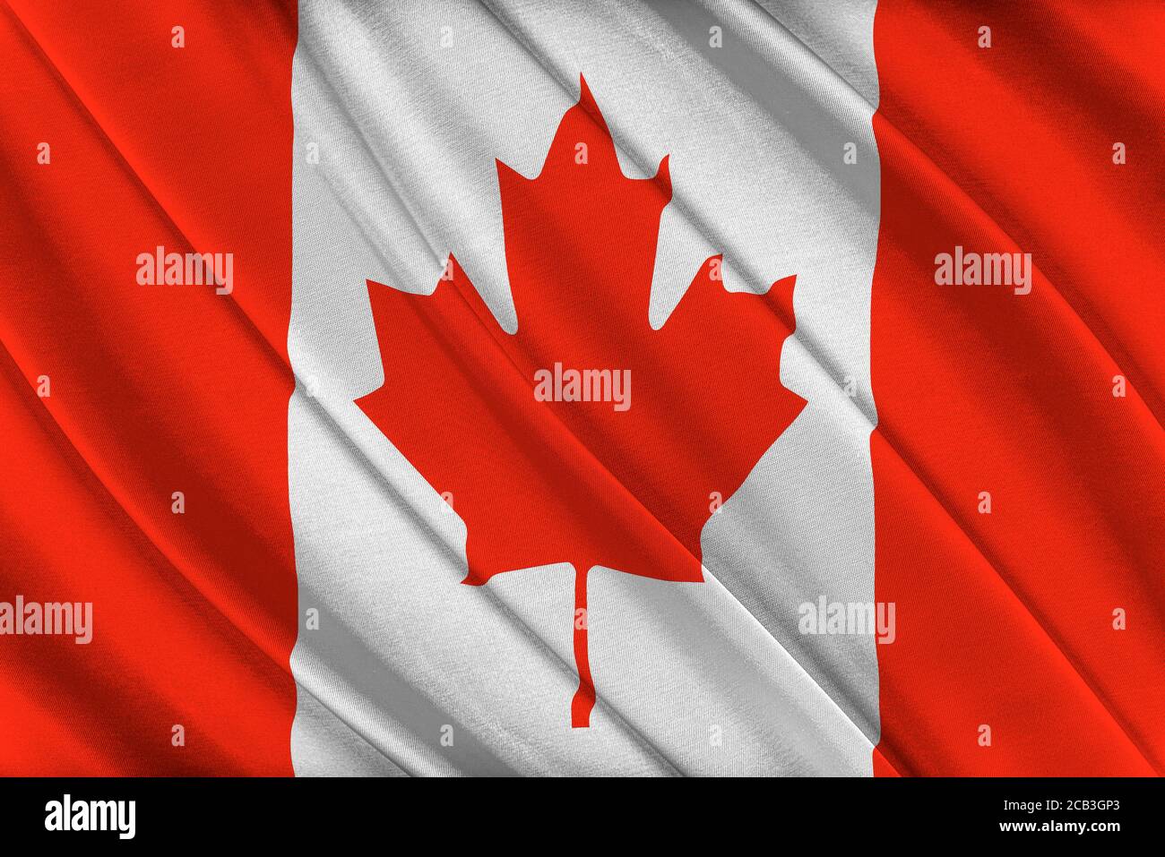 Bandiera canadese colorata che sventola nel vento. Foto Stock