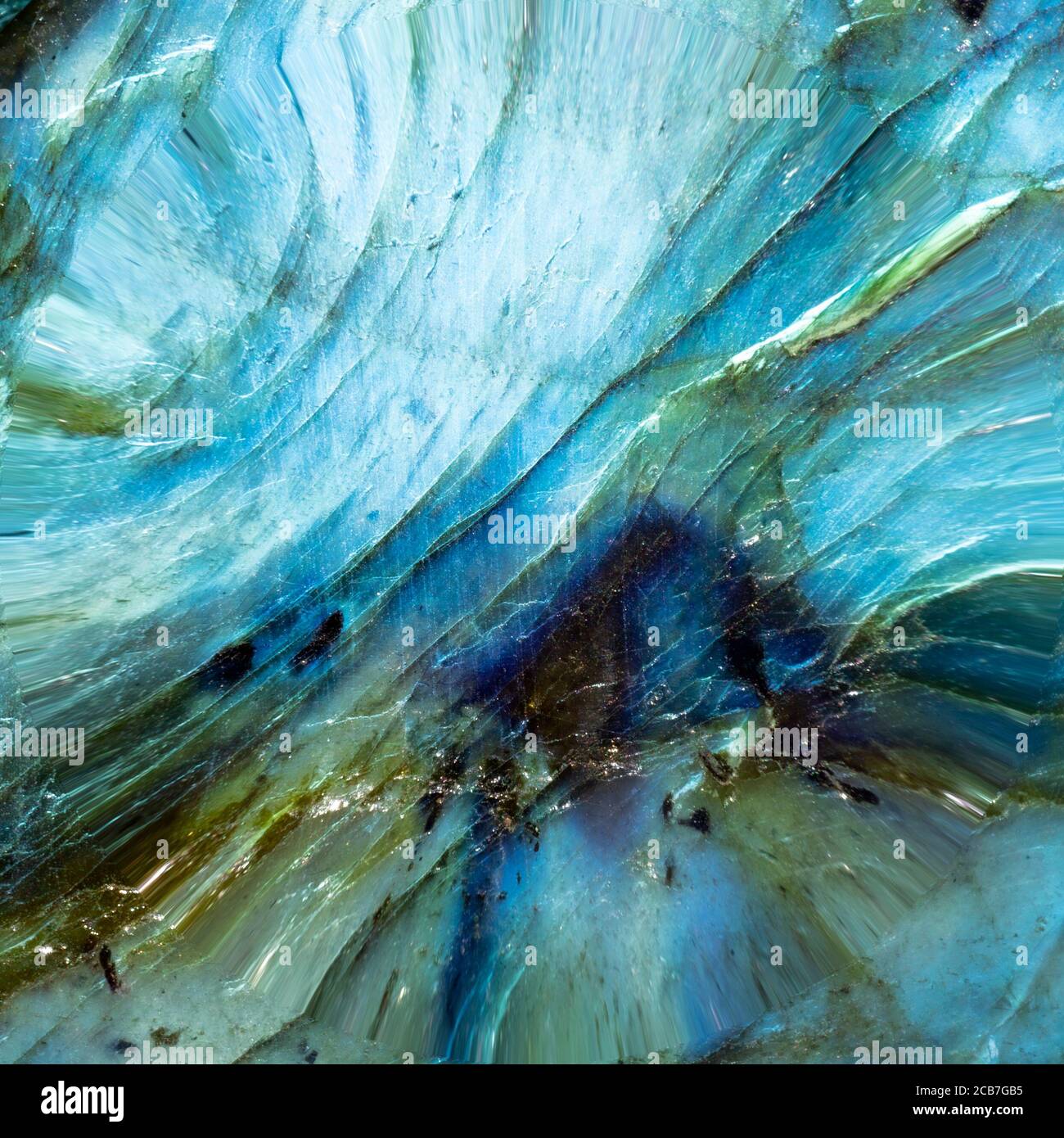 Foto astratta di una pietra blu di labradorite. Ho usato l'illuminazione speciale per far uscire l'oceano blu come le texture e le forme dell'acqua, Foto Stock