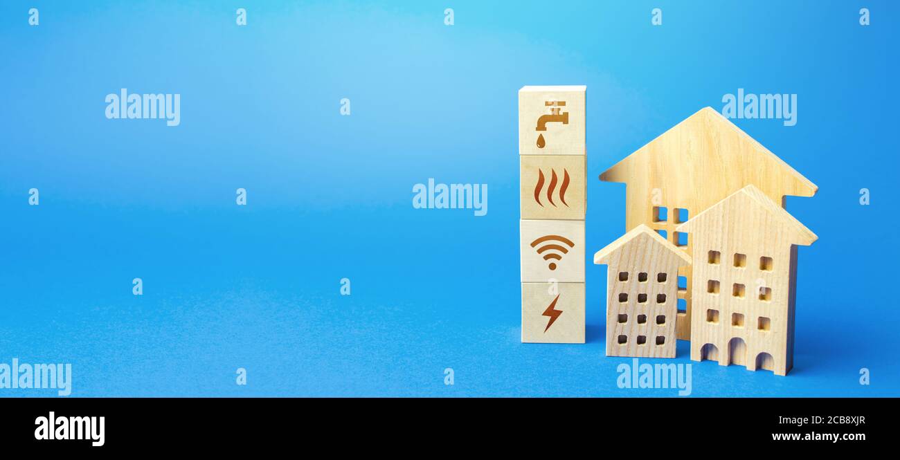 Edifici residenziali e blocchi con simboli di servizi comunali. Servizi pubblici di pubblica utilità. Prezzo, modalità di pagamento, registrazione delle sovvenzioni. Risparmi, re Foto Stock