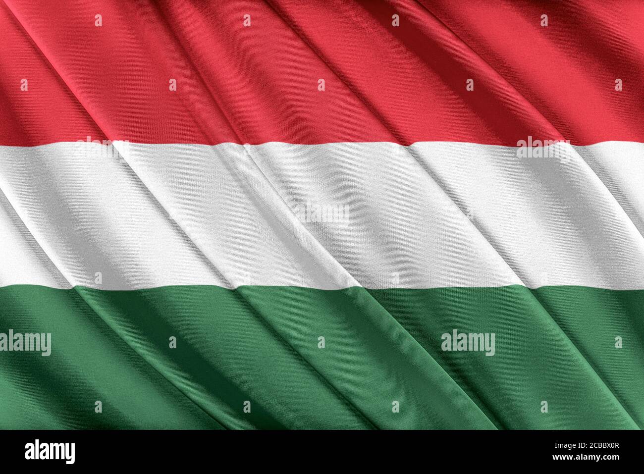 Colorata bandiera ungherese che sventola nel vento. Foto Stock