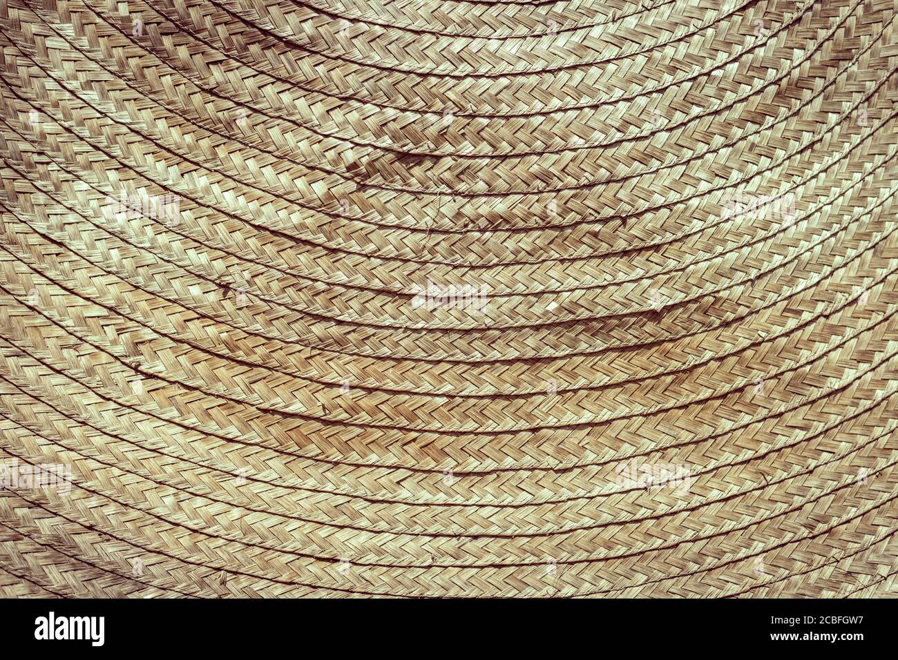 Treccia di bambù rattan intrecciato tessitura asiatica artigianale dettaglio texture vintage tono per sfondo Foto Stock